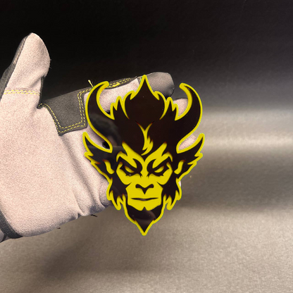 Custom demon monkey automotive badge with bold red and black layered design