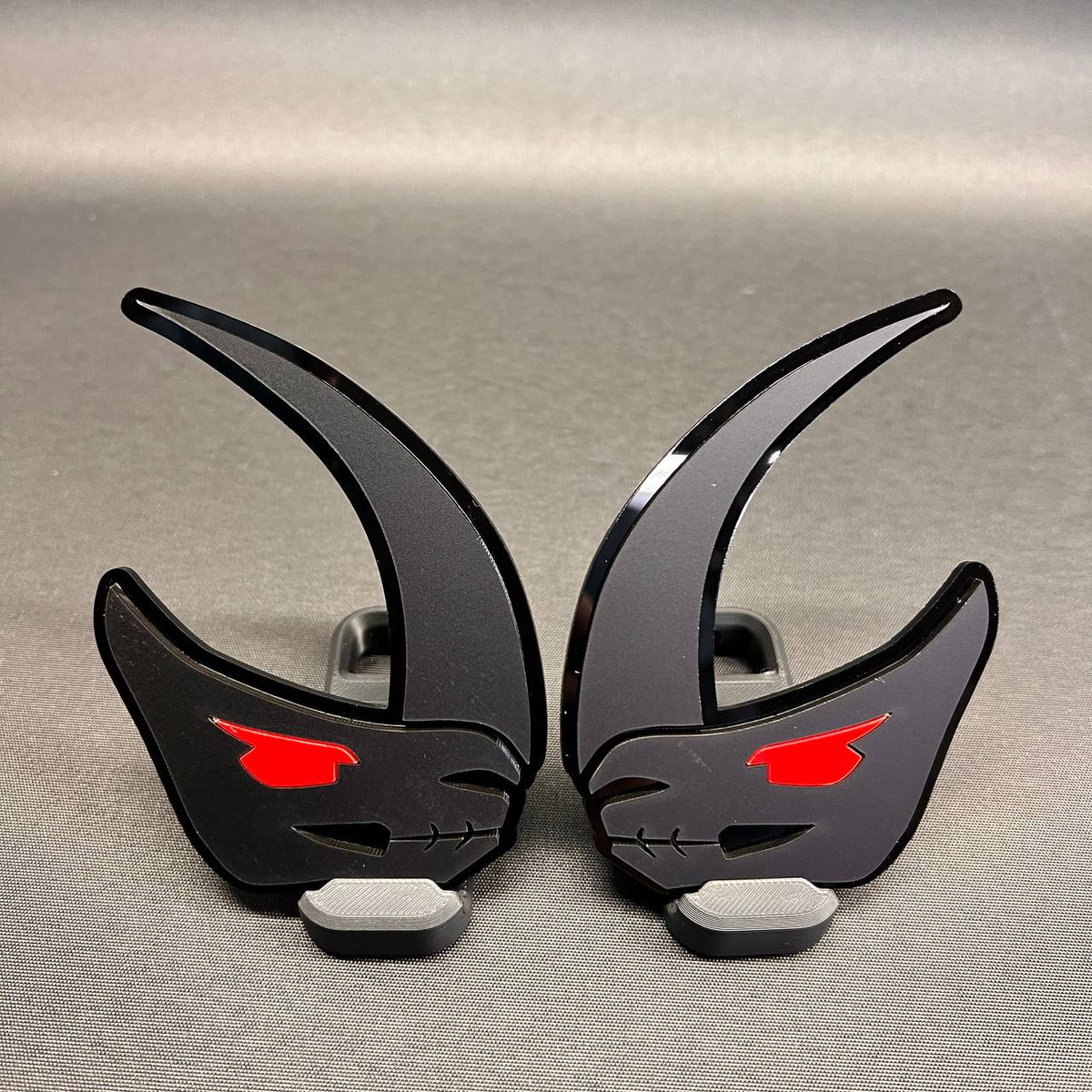 Custom Mudhorn truck badge in brushed silver with black backing