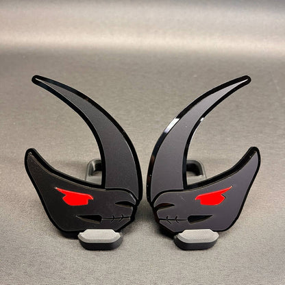 Custom Mudhorn truck badge in brushed silver with black backing