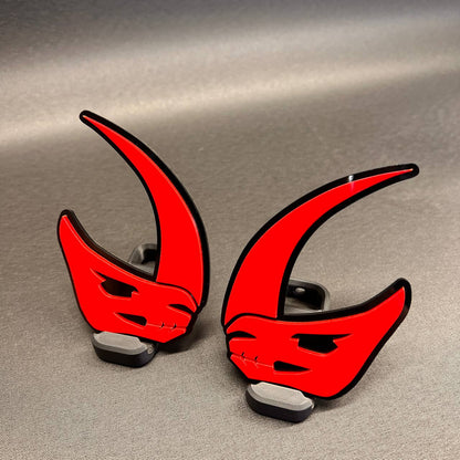 Custom Mudhorn truck badge with red and black layered design