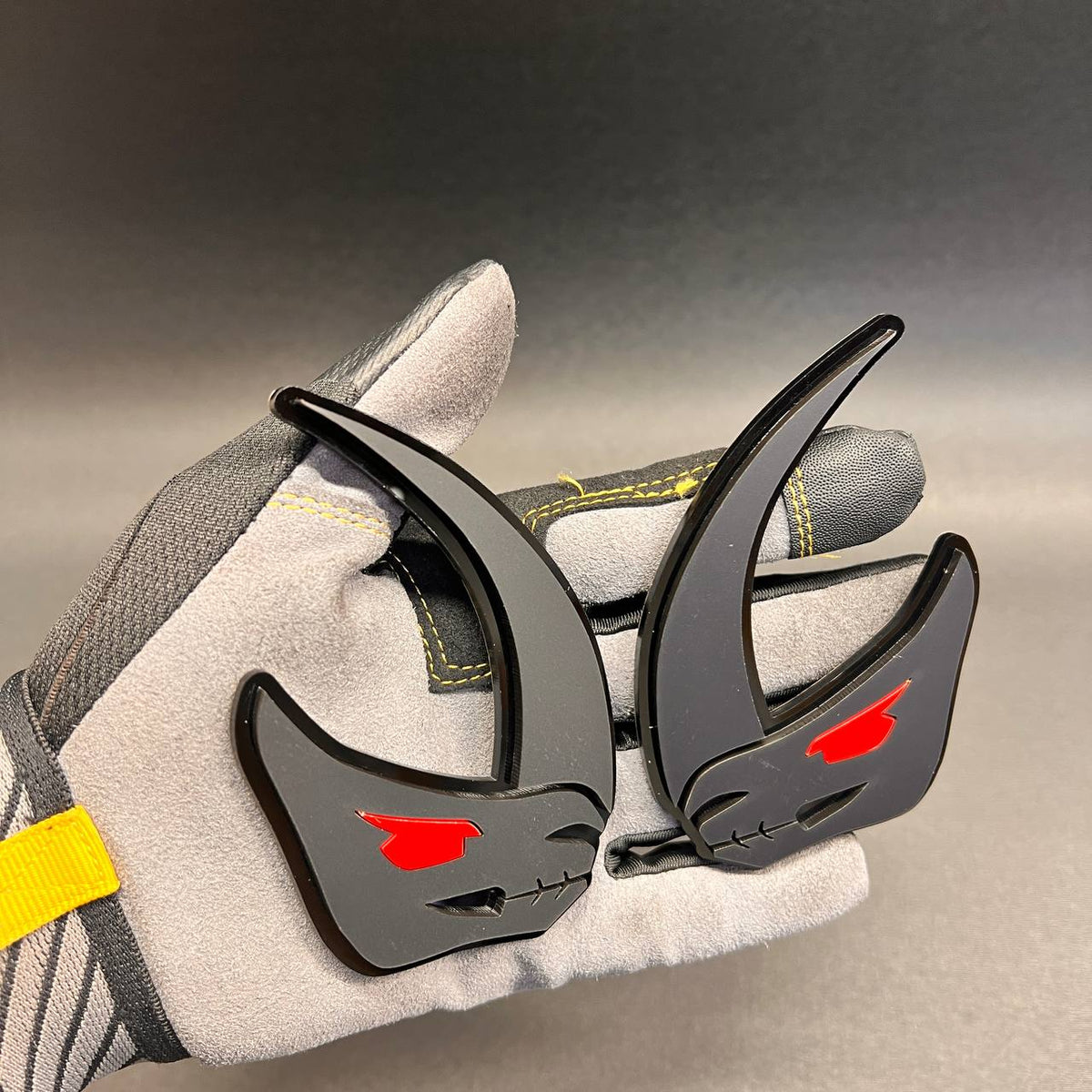 Brushed silver Mudhorn fender badge with glossy black outline