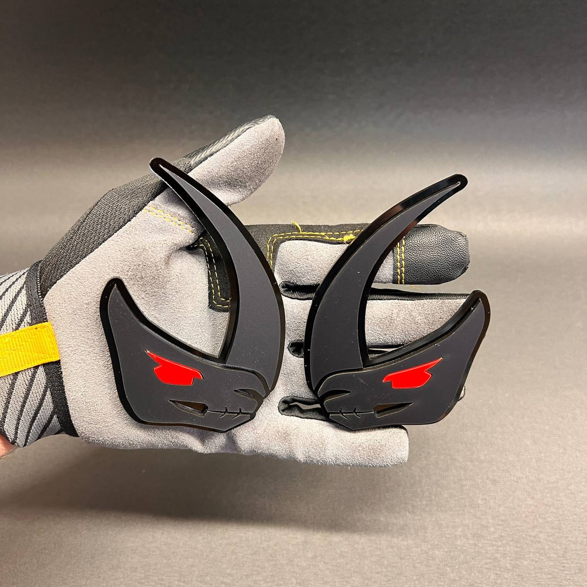 Brushed silver Mudhorn fender badge with glossy black outline