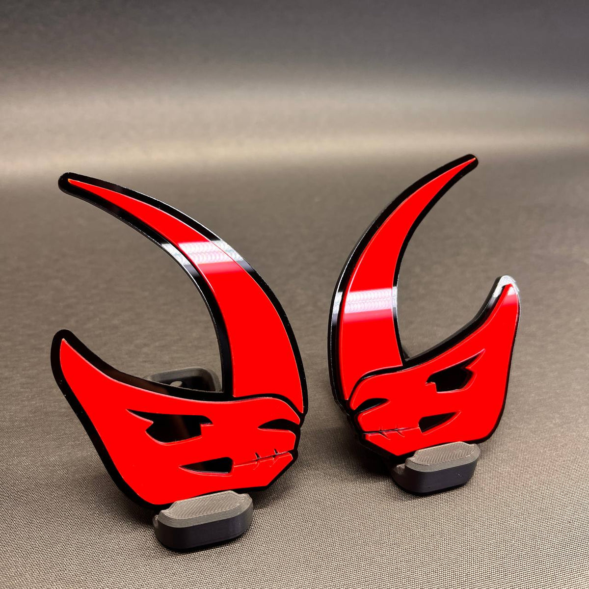 Red and black Mudhorn fender badge for custom vehicle styling