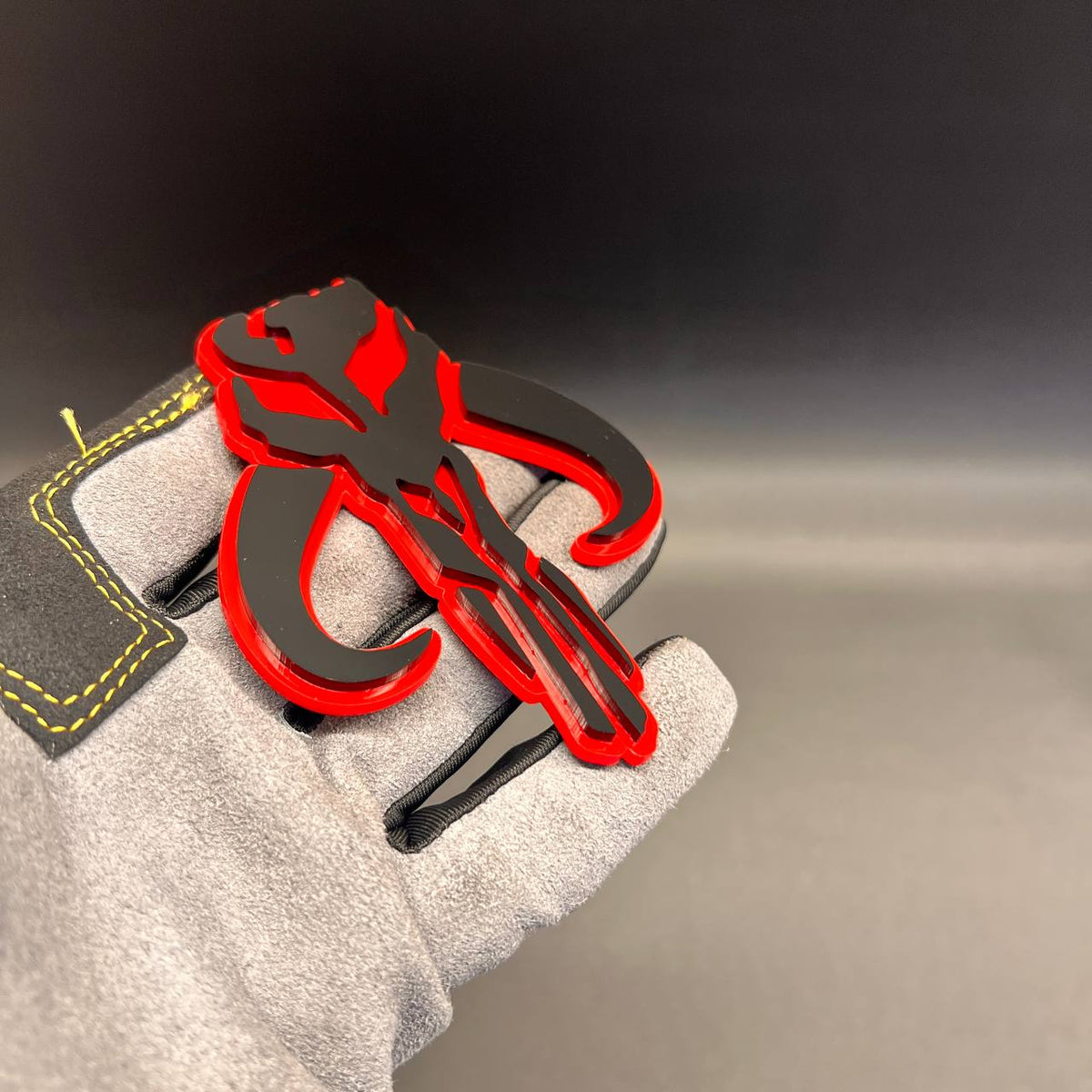 Black and red Mythosaur car badge decorative vehicle emblem