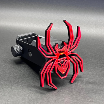 Black Widow spider hitch cover accessory for towing receivers and truck customization.