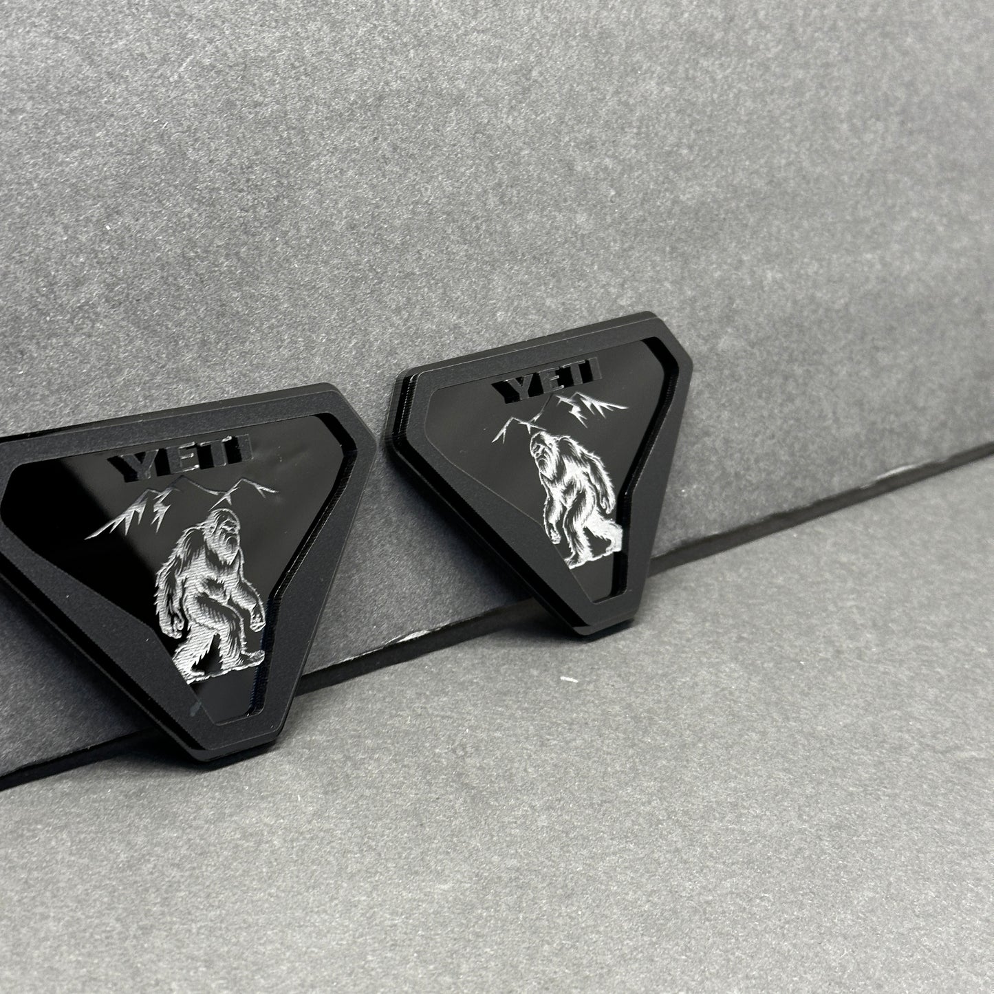 Silver black Yeti walking creature emblem with mountain design