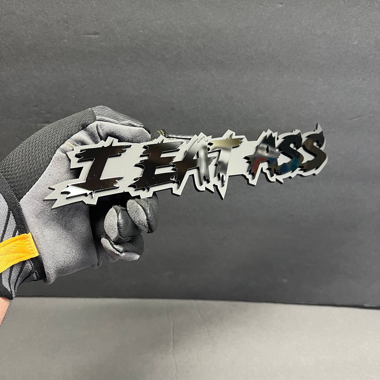 Offensive humor car emblem with layered acrylic lettering for RAM 1500 grille badge modification