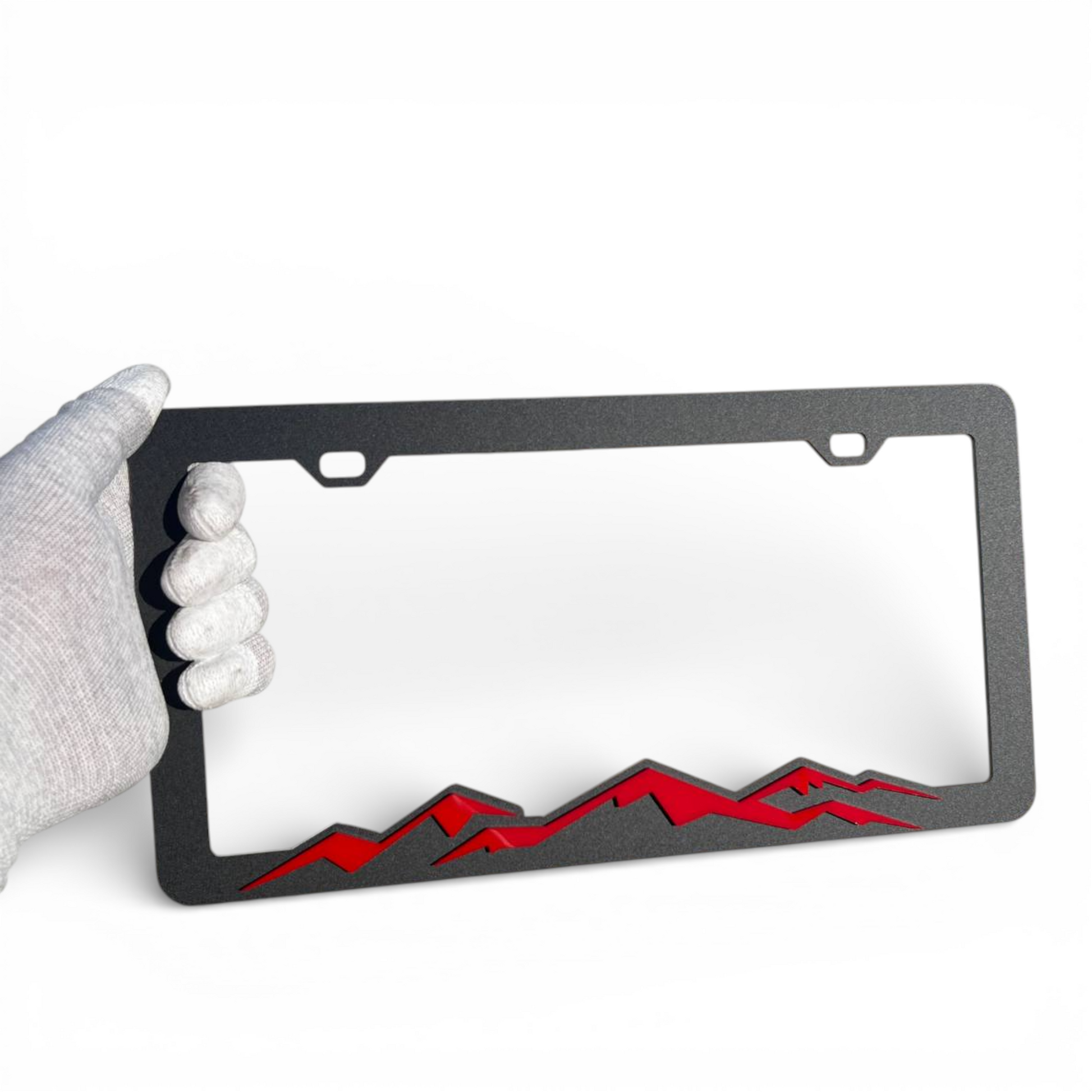 Custom mountain range license plate frame automotive accessory with rugged design