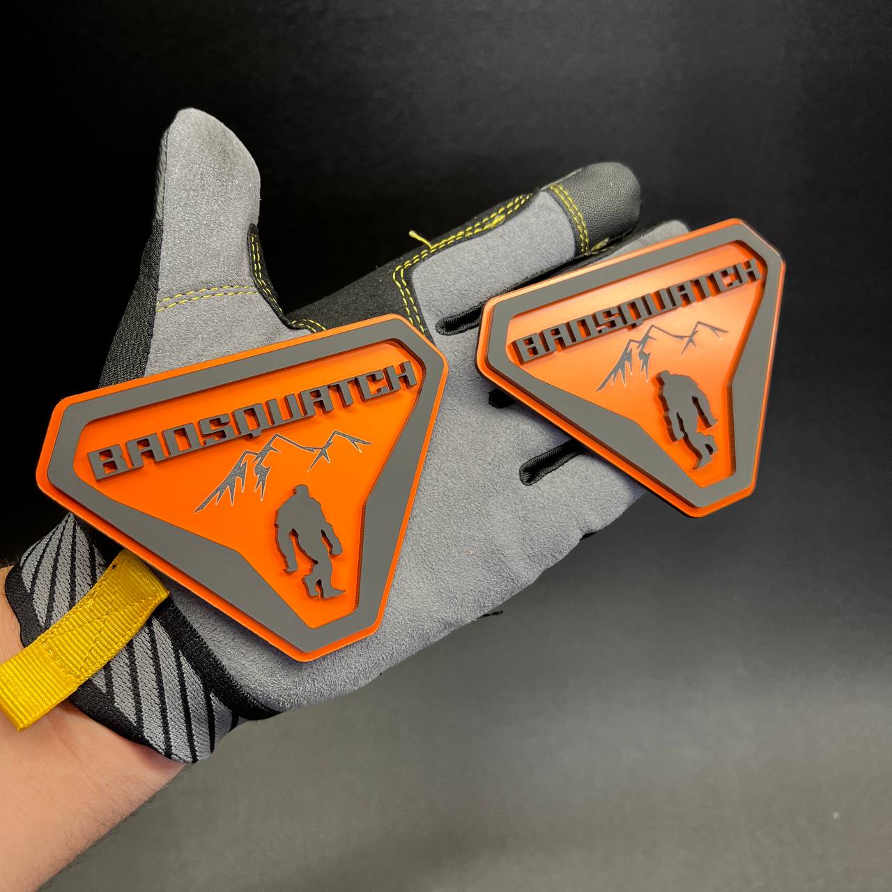 BadSquatch Sasquatch mountain badge with orange background and gray details