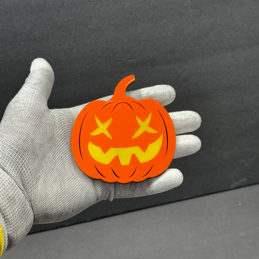 Orange pumpkin car badge fender emblem with yellow jack-o-lantern face