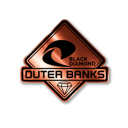 Custom Outer Banks Black Diamond vehicle badge with precision engraved details and clean finish.