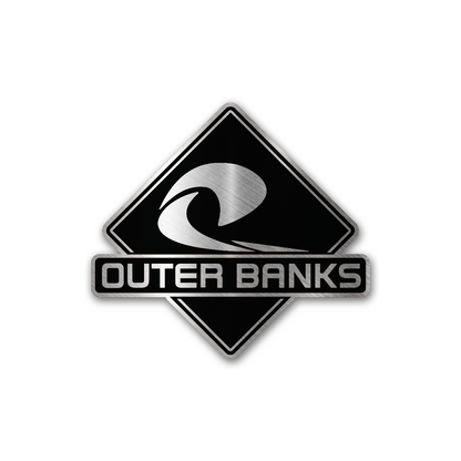Outer Banks beach wave car emblem featuring brushed silver engraving