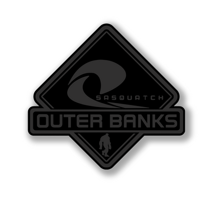 Engraved Outer Banks Sasquatch fender badge with durable multicolor finish.