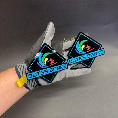Colorful Outer Banks 4x4 car badge with surfer graphic and UV printed finish