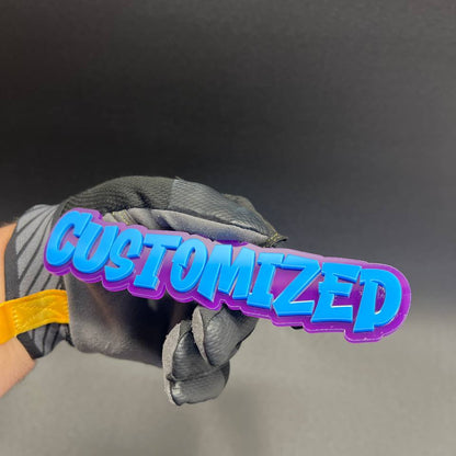 Custom word badge with blue and purple 3D emblem finish