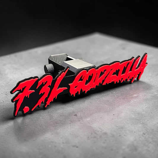 Black custom hitch cover with custom font and automotive styling