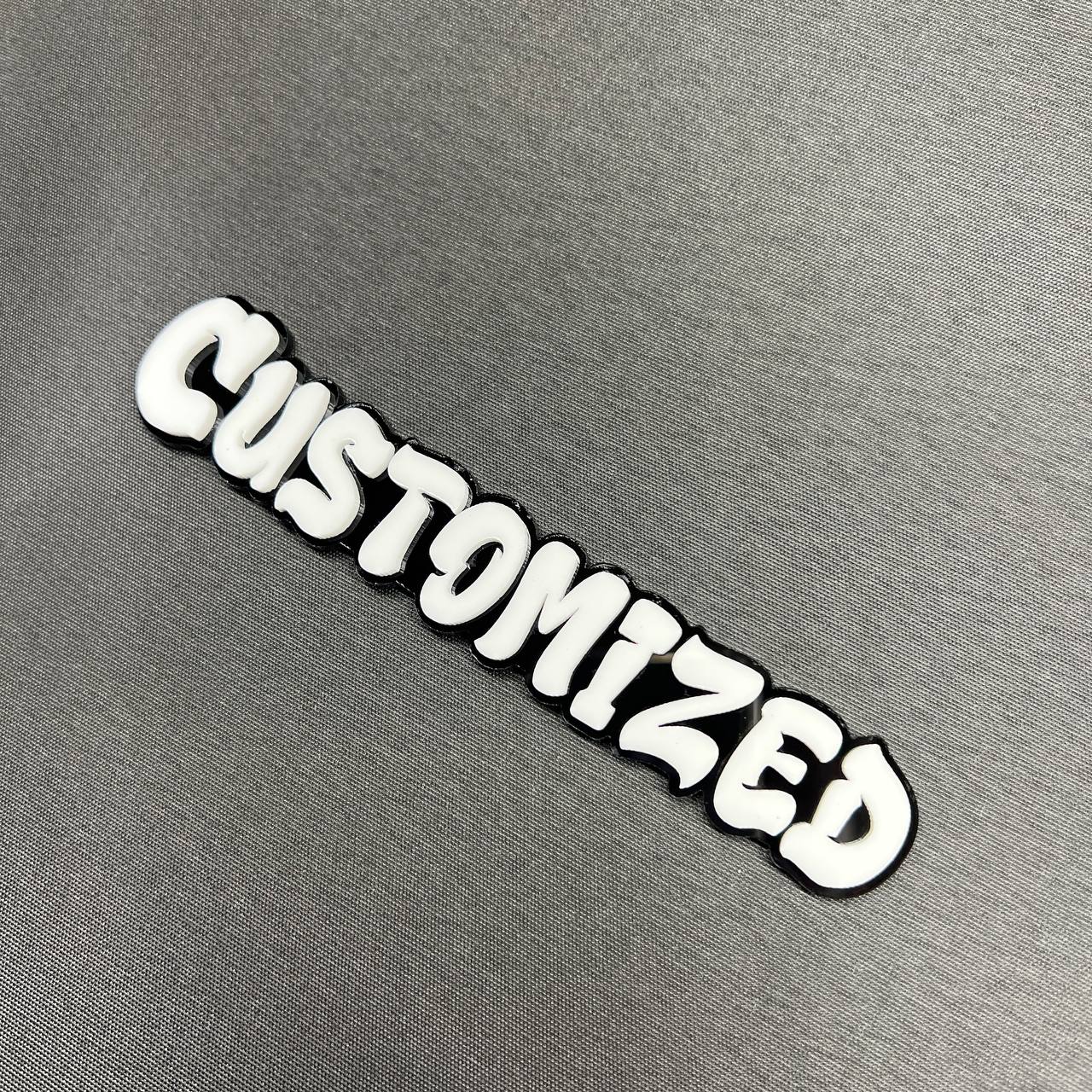 Custom made graffiti letter badge with raised white text