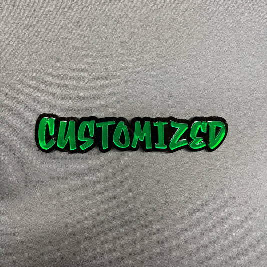 Custom graffiti font car badge with green letters and black background