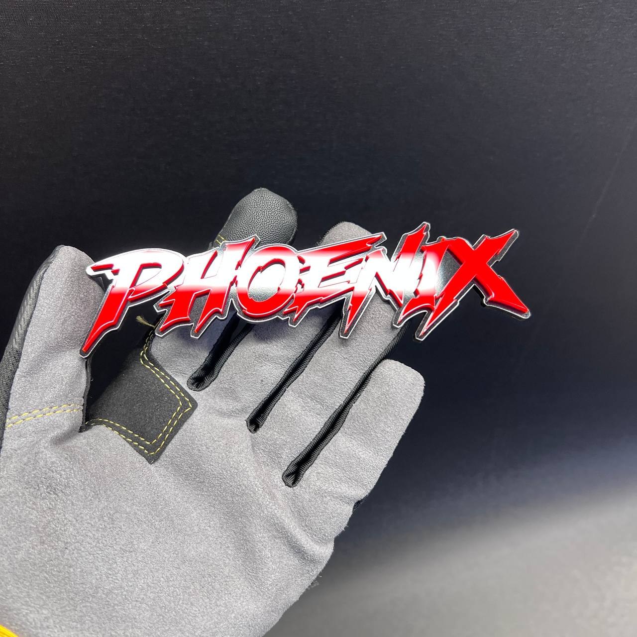 Phoenix red-on-black car text badge for exterior vehicle customization