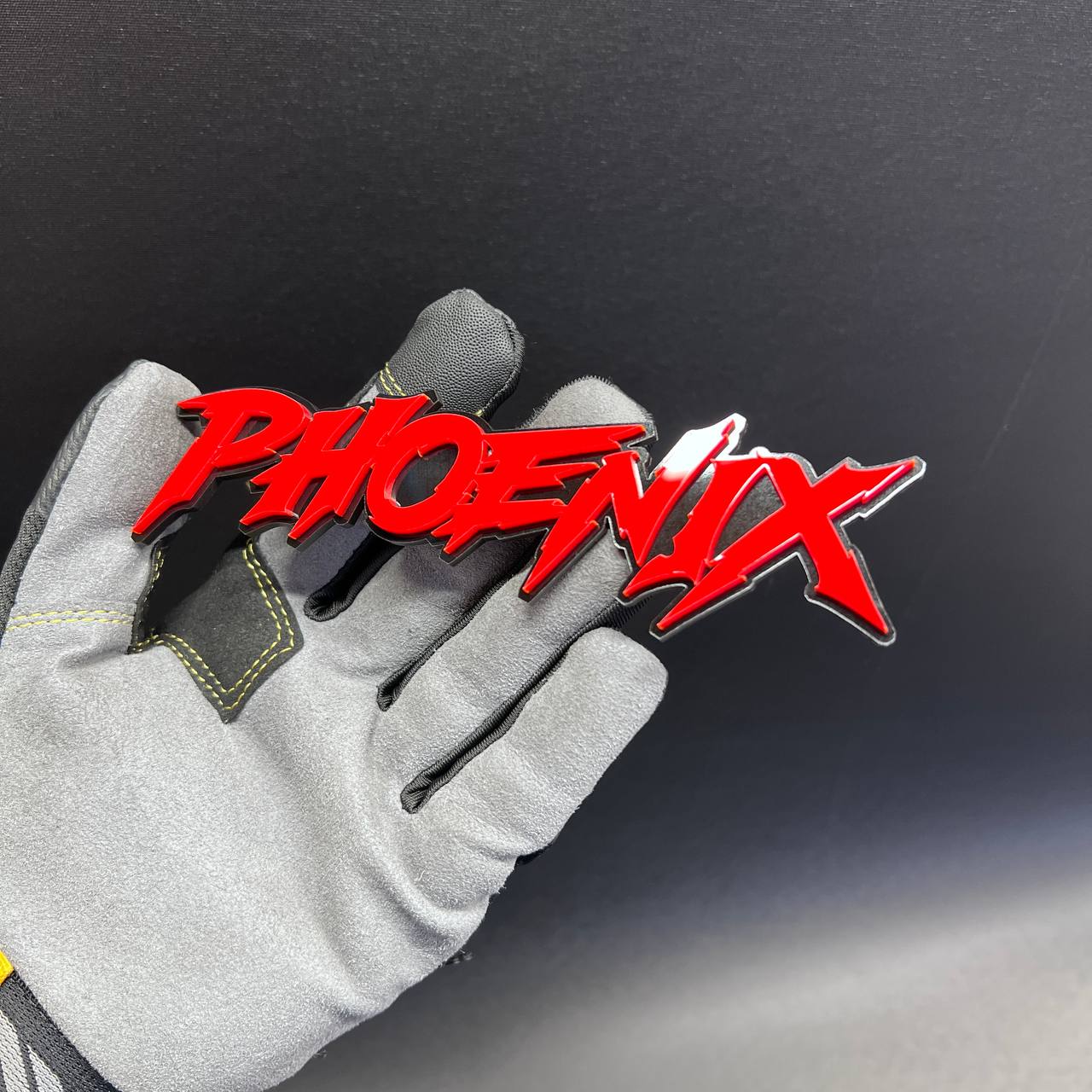Custom Phoenix car badge in aggressive red script design