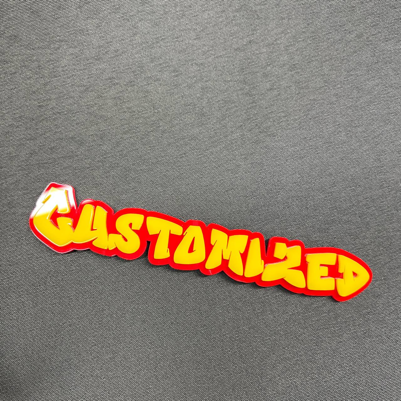 Red and yellow custom graffiti badge for car exterior decoration.