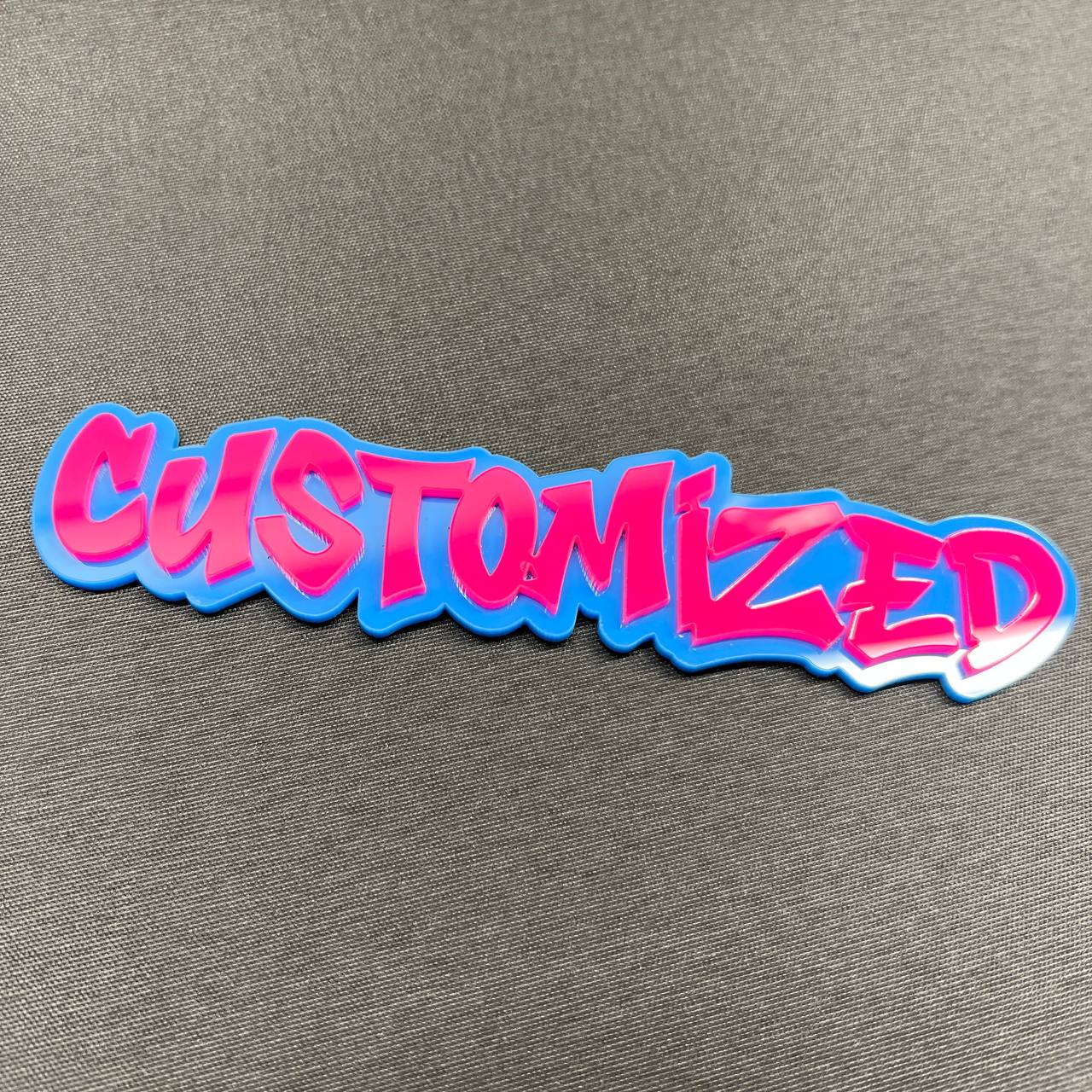 Two tone custom text badge in bright pink and blue graffiti style