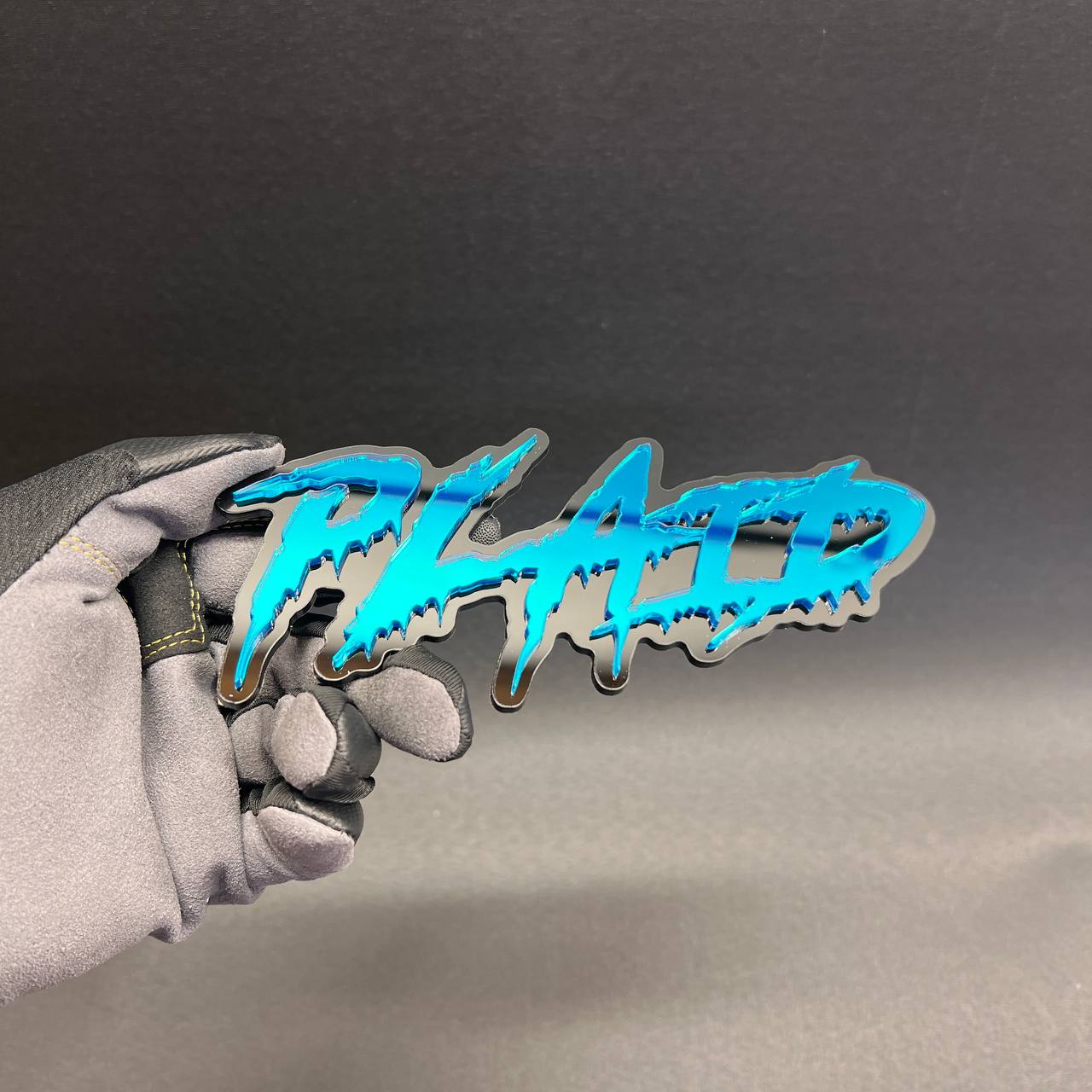Blue and black PLAID auto badge for fender or tailgate