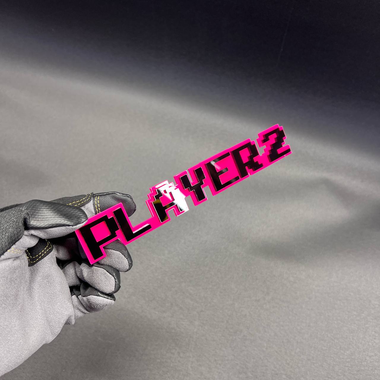 Handmade PLAYER 2 car badge designed for gamer themed exterior styling.