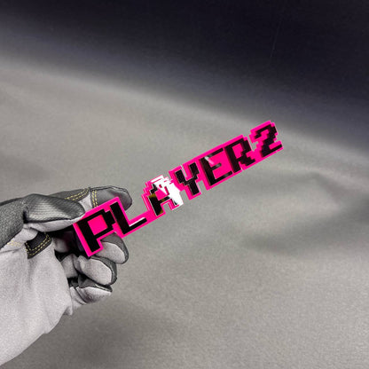 Handmade PLAYER 2 car badge designed for gamer themed exterior styling.