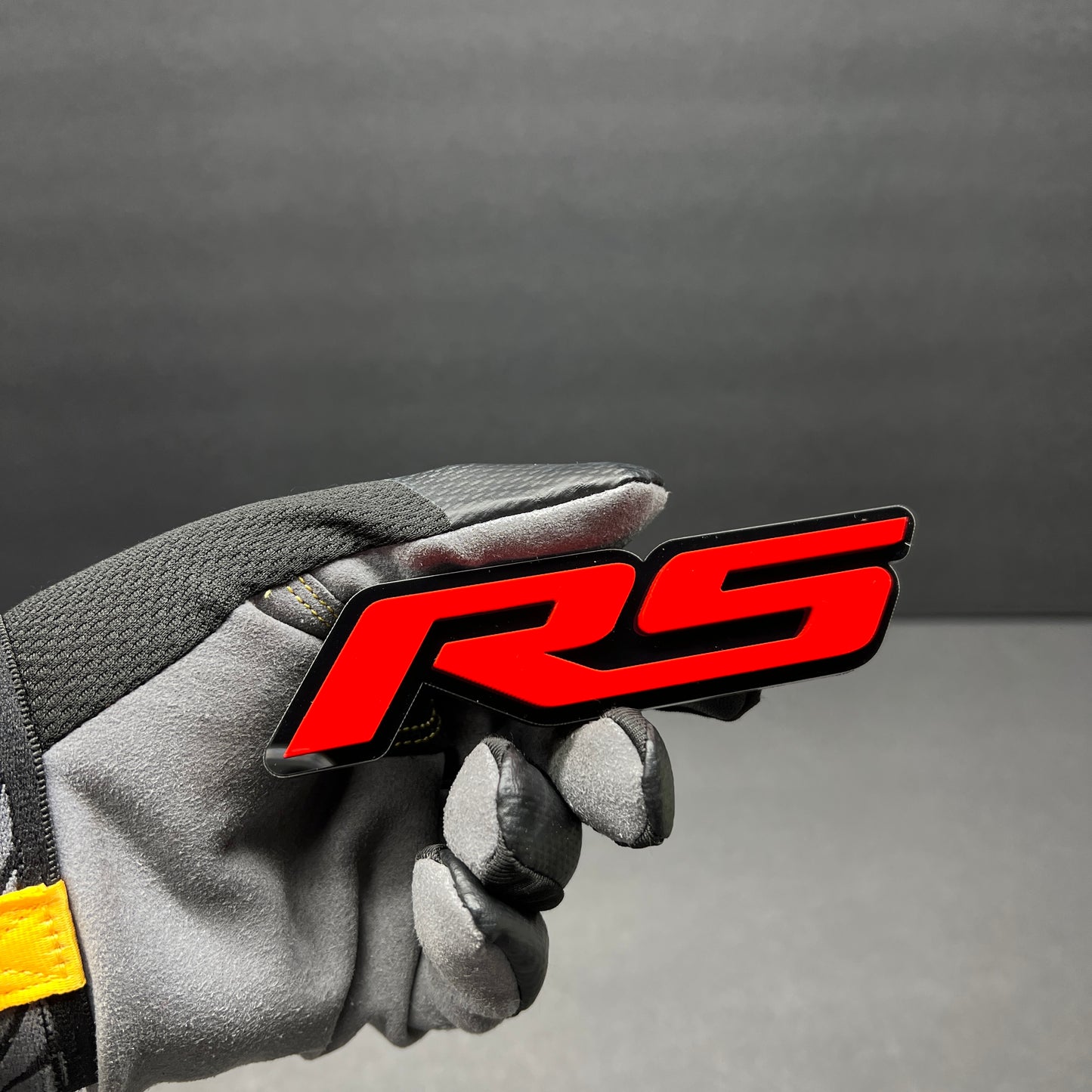 RS performance emblem for Audi RS Q3 custom vehicle appearance.