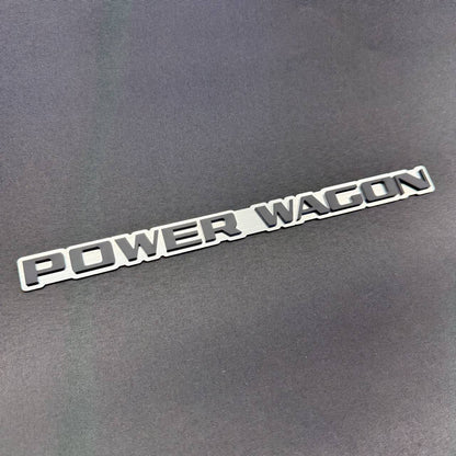 Dodge Power Wagon silver and black truck emblem with 3M automotive adhesive for flat fender, tailgate and body surfaces.