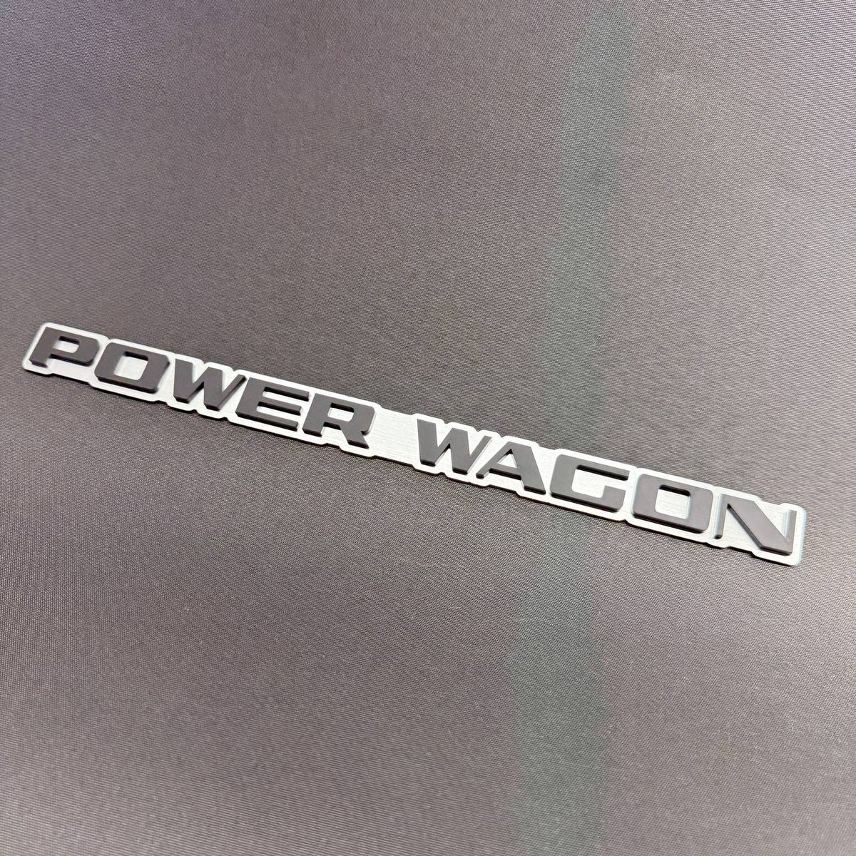 Power Wagon decorative car text badge for Ram 1500, 2500 and 3500 trucks with raised lettering and silver outline.