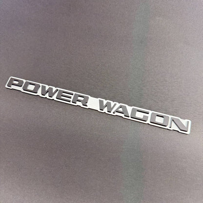 Power Wagon decorative car text badge for Ram 1500, 2500 and 3500 trucks with raised lettering and silver outline.