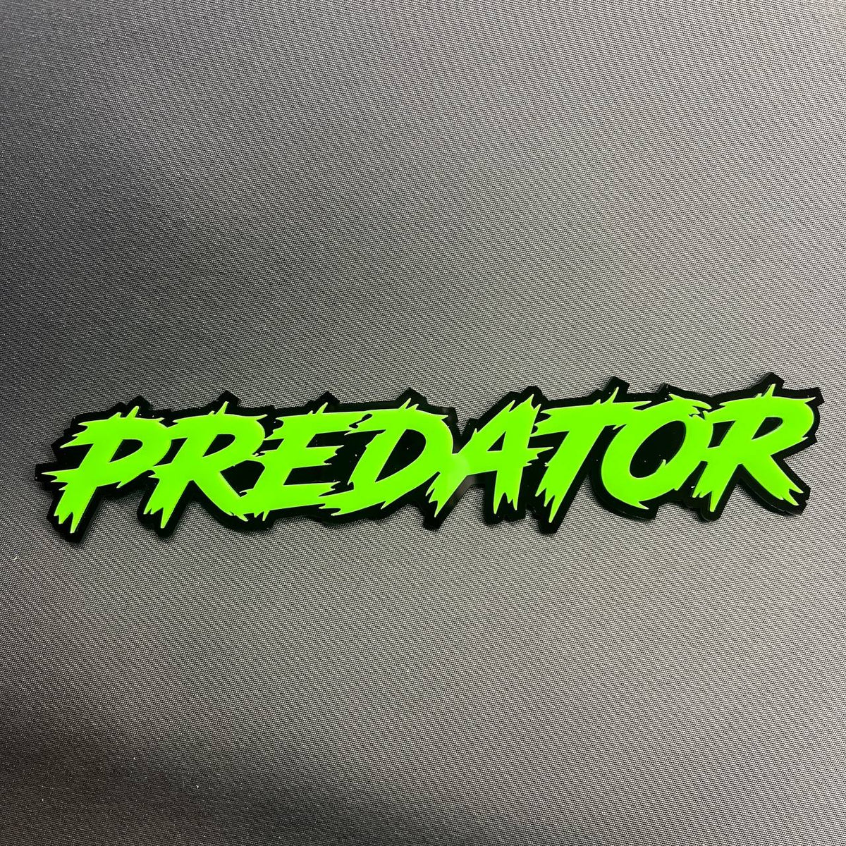 Custom Predator car badge with bright green lettering and black base for truck SUV or automotive exterior