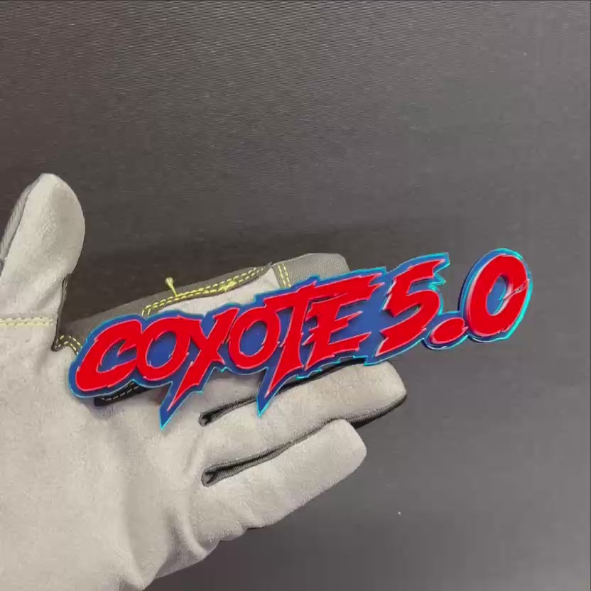 Custom Coyote 5.0 car badge with glossy red letters and blue outline