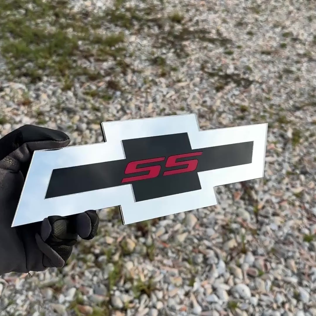 Chevy Bowtie SS car badge in silver, black, and red finish