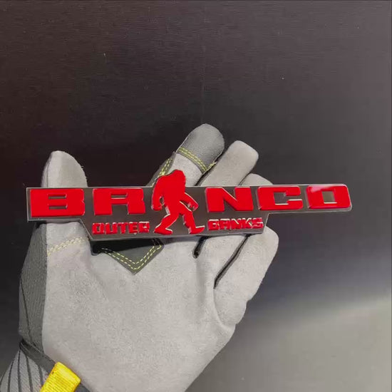 Ford Bronco Outer Banks Sasquatch exterior emblem in red and black