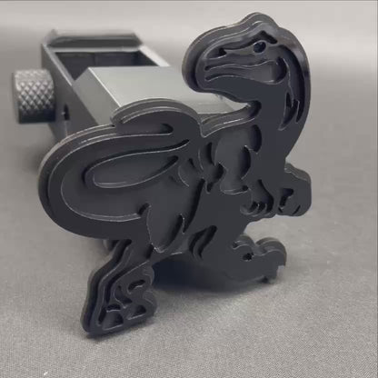 Black and silver Raptor hitch cover truck accessory