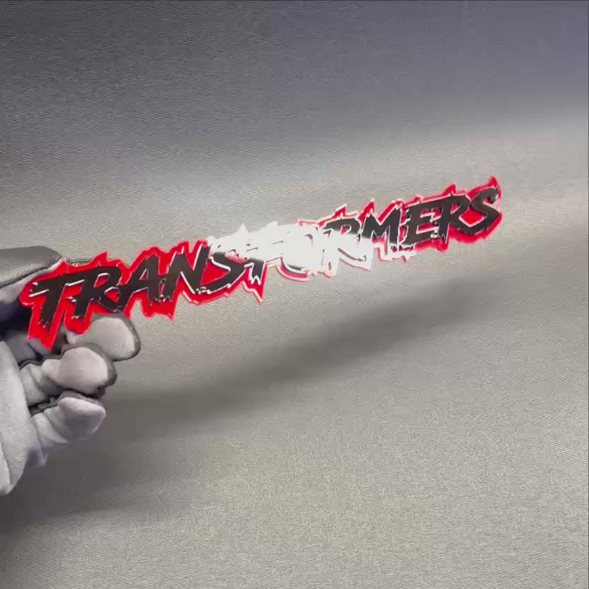 Custom TRANSFORMER exterior car badge with red outline and black layered lettering