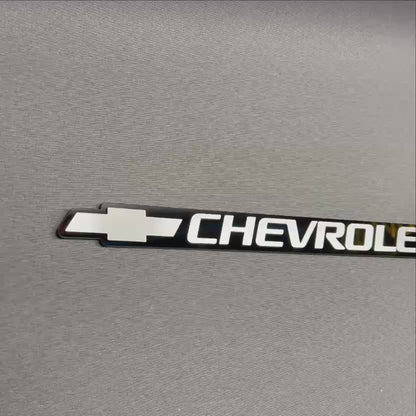 Replacement Chevrolet silver Bowtie tailgate badge for 1999-2006 models.
