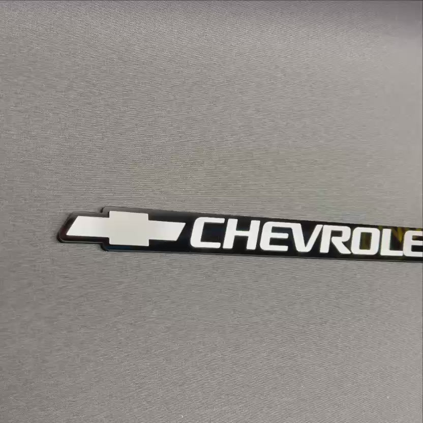 Replacement Chevrolet silver Bowtie tailgate badge for 1999-2006 models.