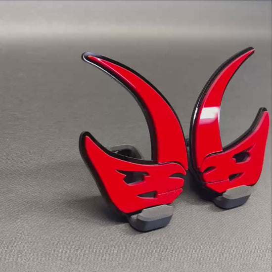 Custom Mudhorn vehicle emblem in red and black automotive finish