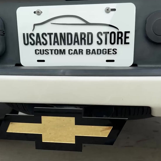 Chevrolet Bowtie hitch cover in mirror gold and black for truck receiver