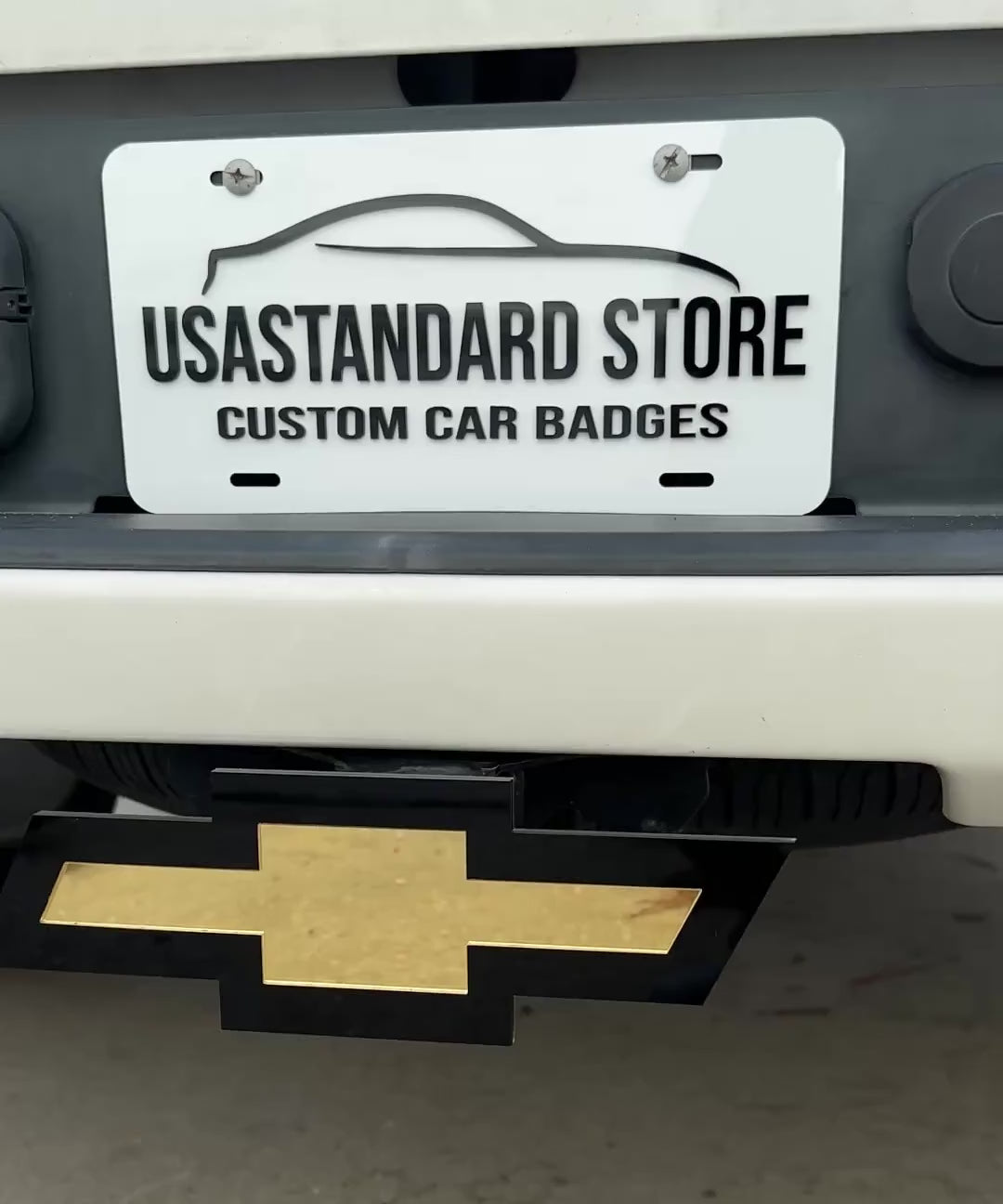 Chevrolet Bowtie hitch cover in mirror gold and black for truck receiver