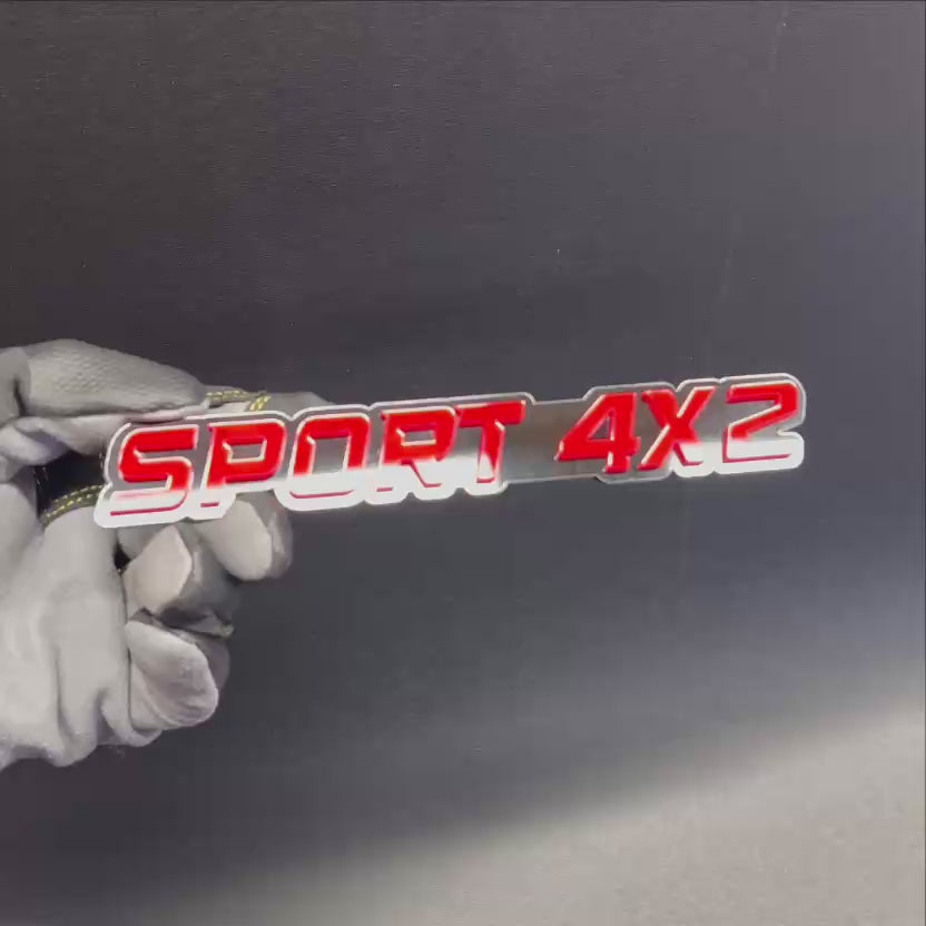 SPORT 4x2 automotive text badge featuring bright red letters on a black background.