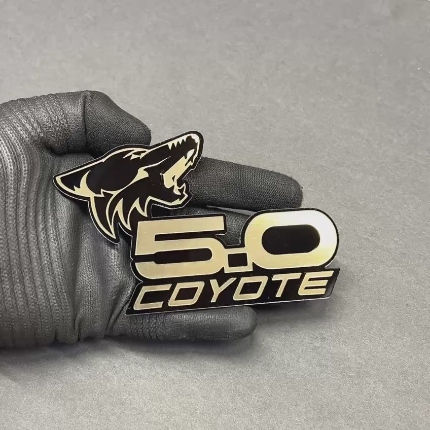 Brushed gold Coyote 5.0 emblem badge with black base for Ford Mustang GT and F150 trucks – custom acrylic car badge with premium metallic finish