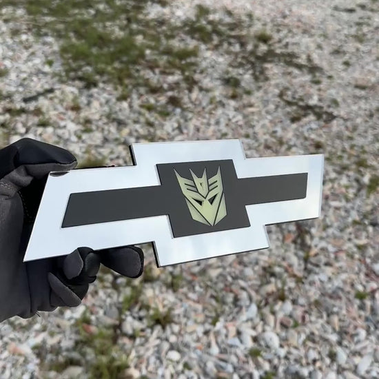 Chevrolet Bowtie emblem with silver finish and glow Decepticon logo