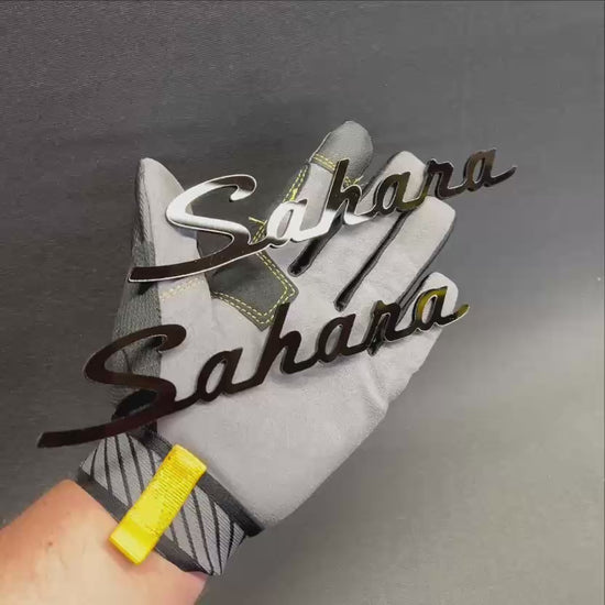 Custom Sahara car emblem badge displayed in black and gray color options