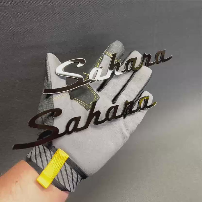 Custom Sahara car emblem badge displayed in black and gray color options
