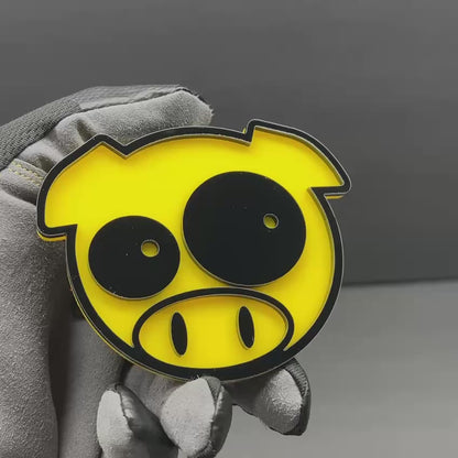 Cartoon pig vehicle emblem in yellow and black for car or truck exterior